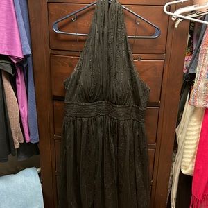 Lightly beaded backless cocktail dress.